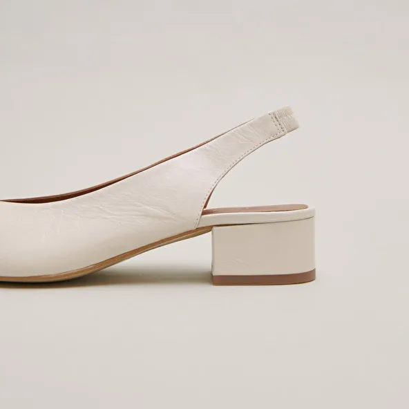 Ballet flats with open backs in ecru distressed leather